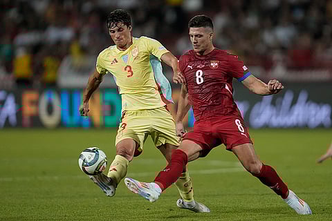 2024-25 Nations League Football Serbia vs Spain: Spain's Robin Le Normand, left, challenges for the ball with Serbia's Luka Jovic